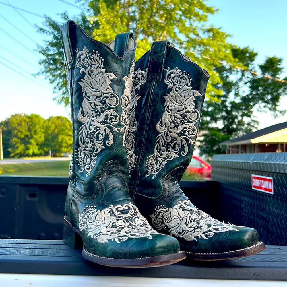 dark green CORRAL boots with lace and studs.